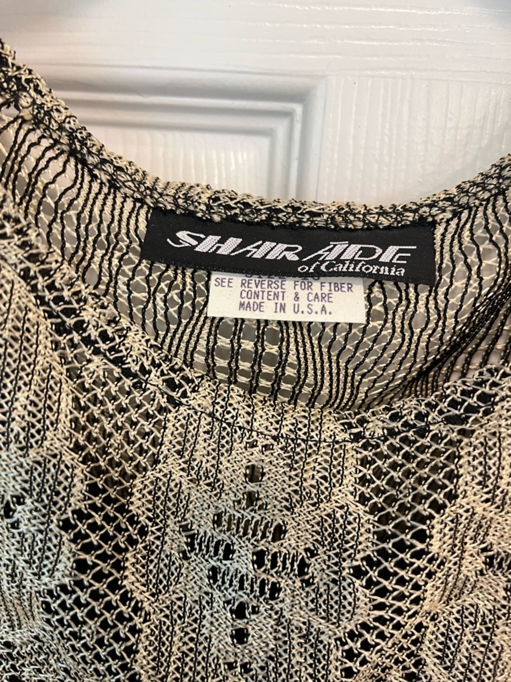 TSE Black and Cream Open Stitch Crewneck Sweater over black dress size 18